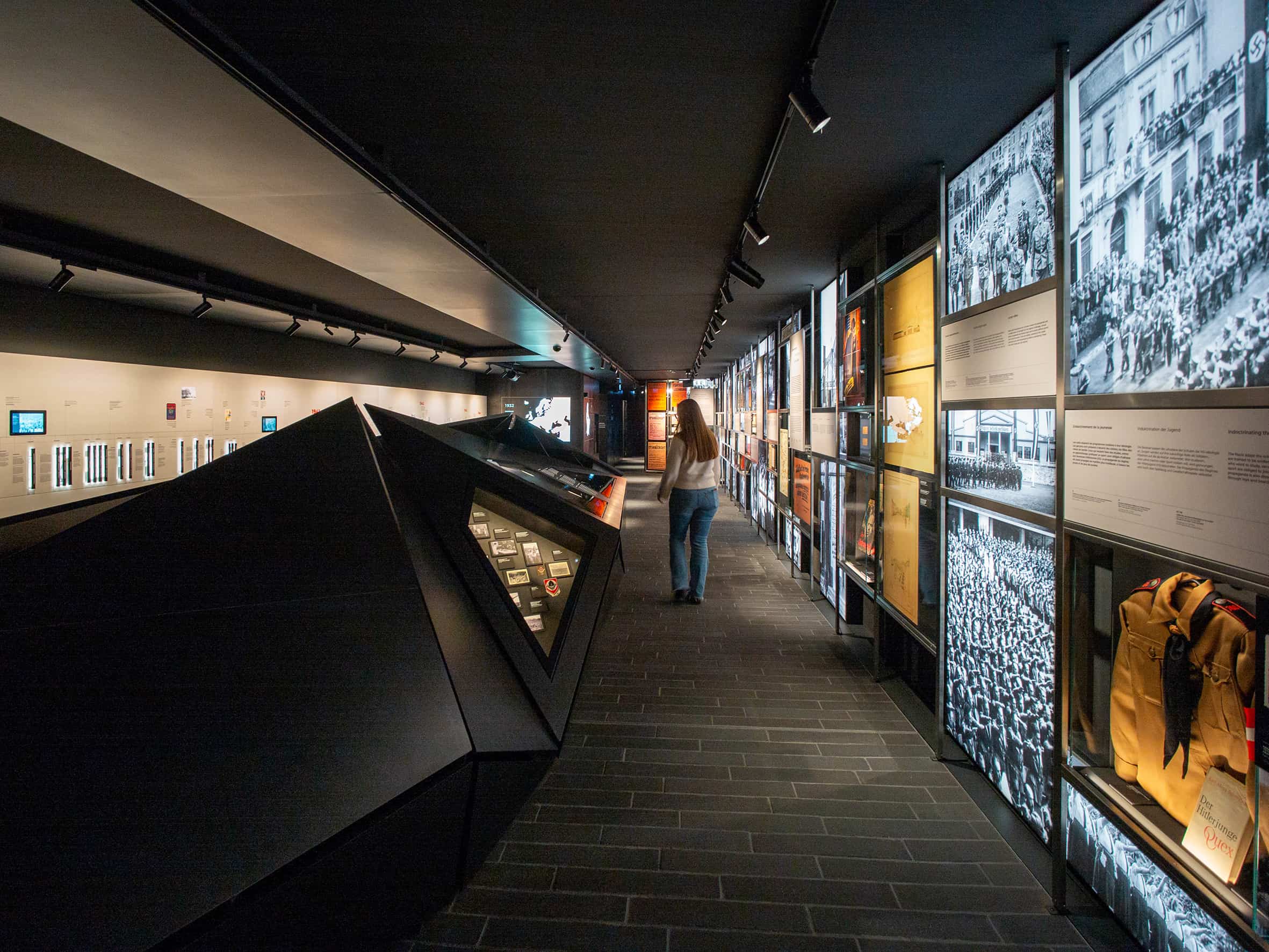 The permanent exhibition, with sculptural display case, timeline and large backlit images.