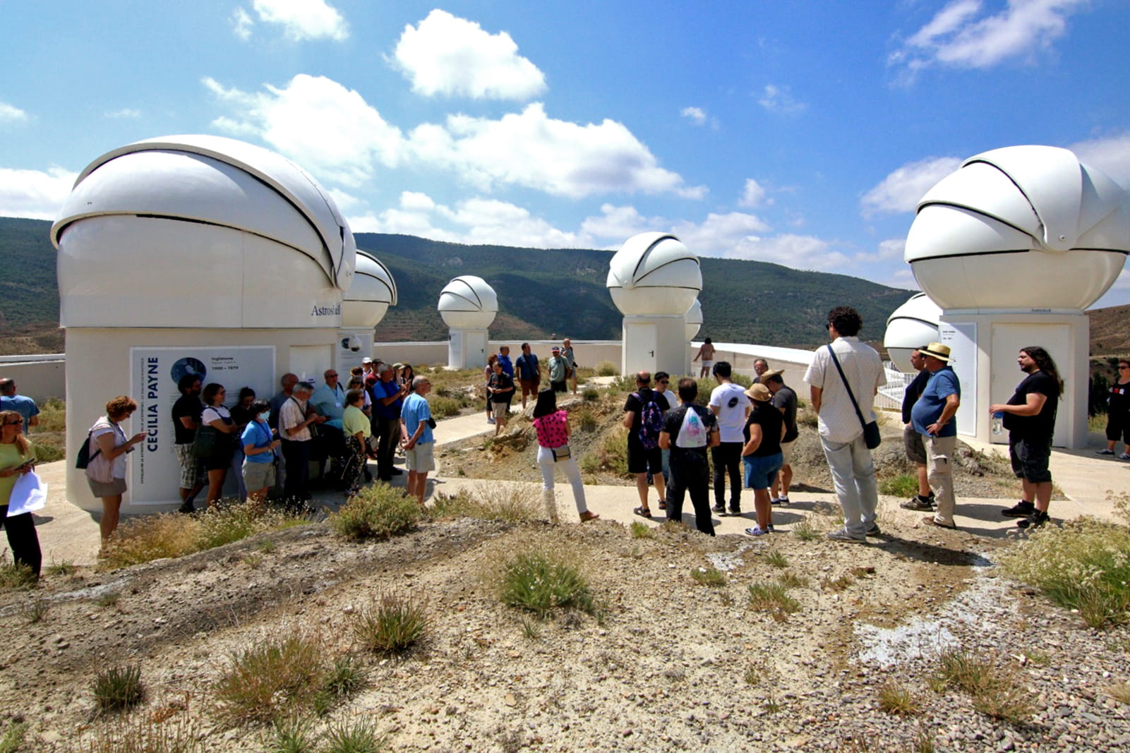 A group viewing the courtyard dome area during a guided tour at Galáctica.